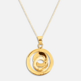 Gold necklace with a spiral pendant on a white background