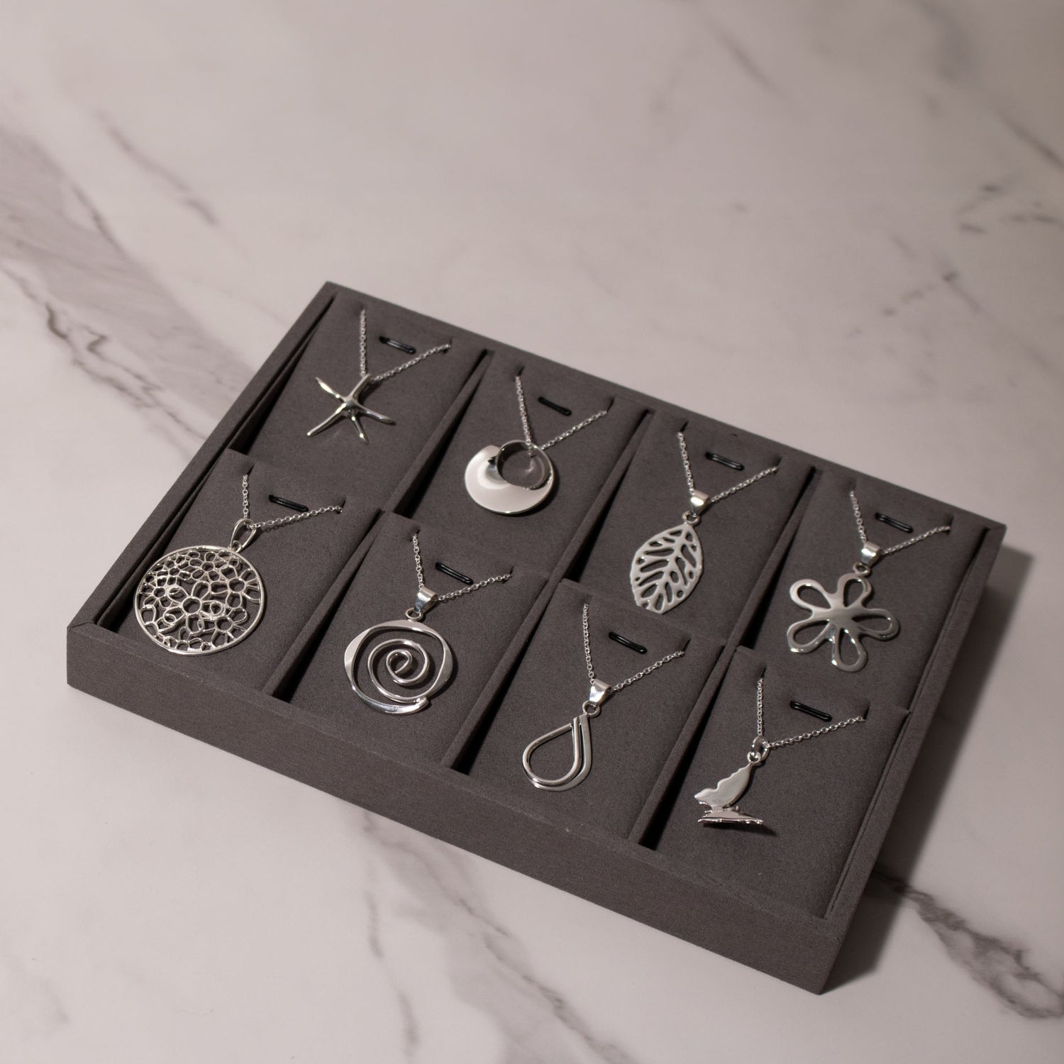 a collection of pendant neckalces