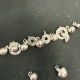 Assortment silver charms