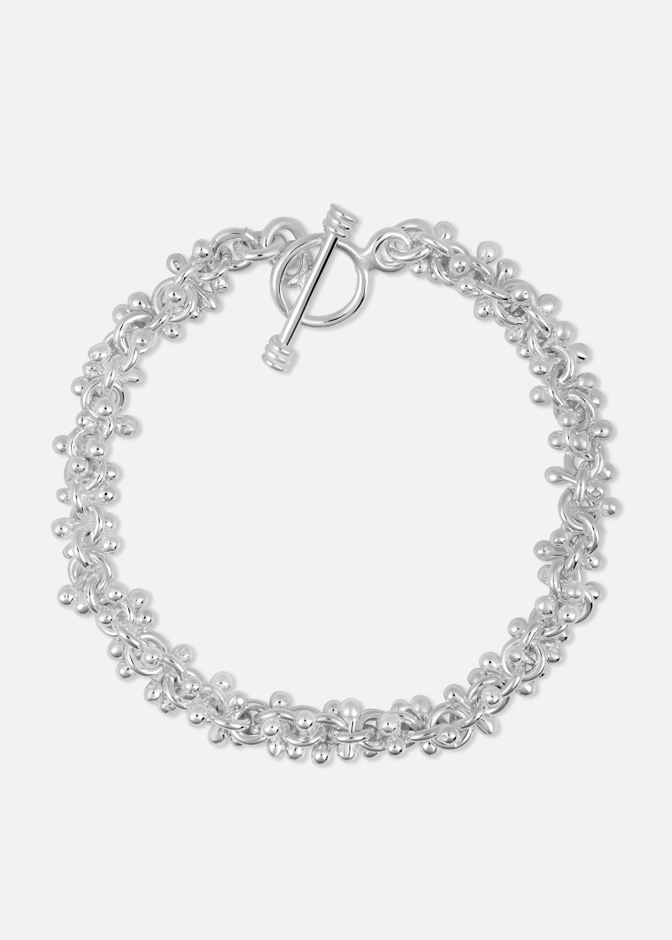 A silver-colored cluster ball bracelet with multiple small spherical charms arranged in a patterned design, featuring a toggle clasp.