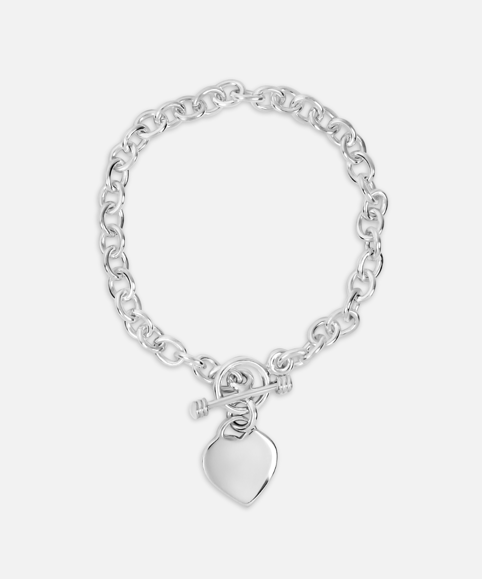 A silver bracelet with an oval link chain and a heart-shaped charm pendant, displayed against a white background.