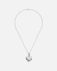 Silver heart-shaped pendant necklace on a white background