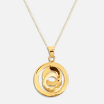 Gold necklace with a spiral pendant on a white background