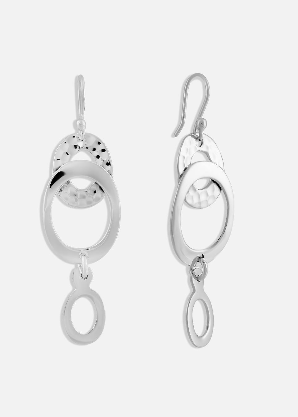 A pair of silver, hammered linked oval earrings on a white background.