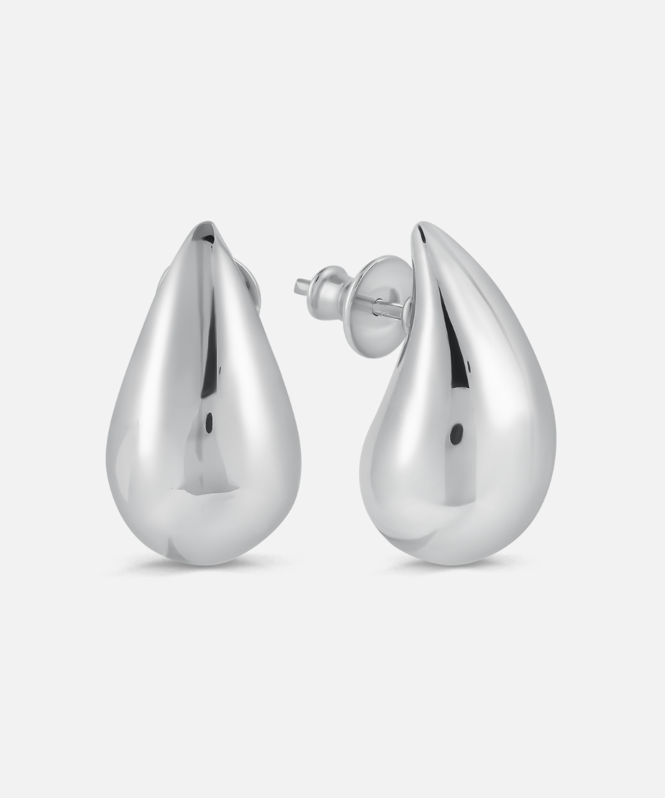 Pair of silver teardrop earrings on a white background