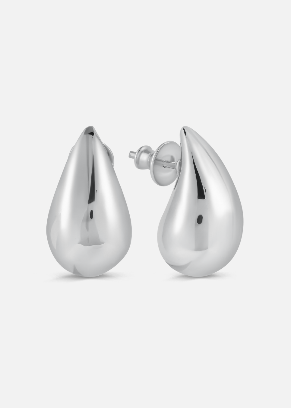 Pair of silver teardrop earrings on a white background