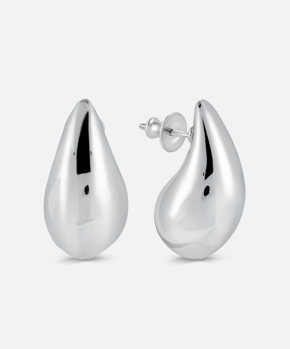 Pair of silver teardrop earrings on a white background
