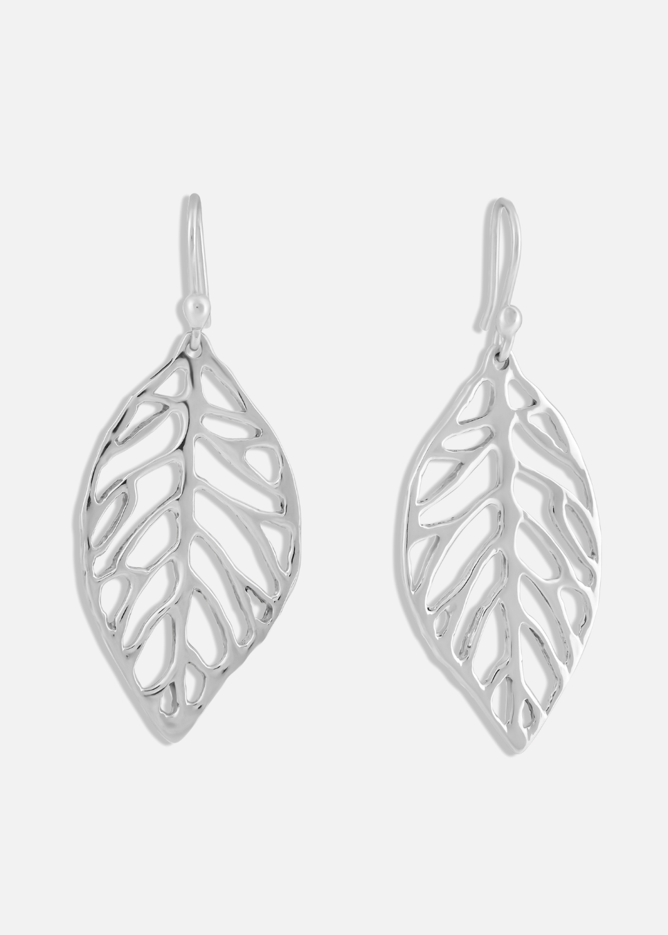 Silver leaf-shaped earrings on a white background