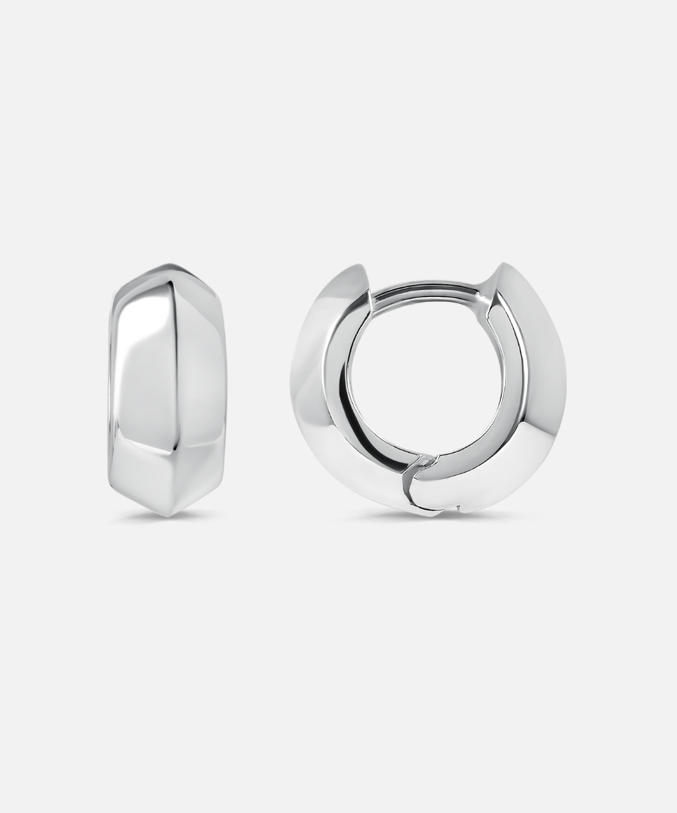 Pair of silver hoop earrings on a light gray background