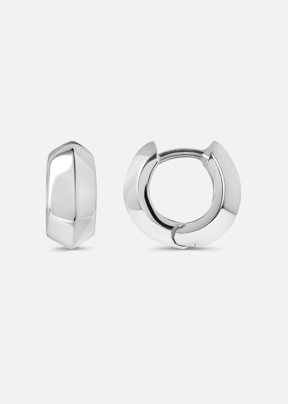 Pair of silver hoop earrings on a light gray background