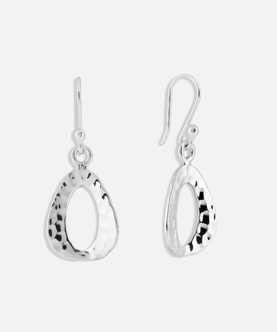 A pair of textured triangle drop earrings made with hammered sterling silver, with hoop ear fixings.
