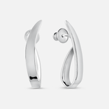 A pair of polished silver huggie hoop earrings with a modern, fluid curved design, shown from both front and side angles on a light gray background.