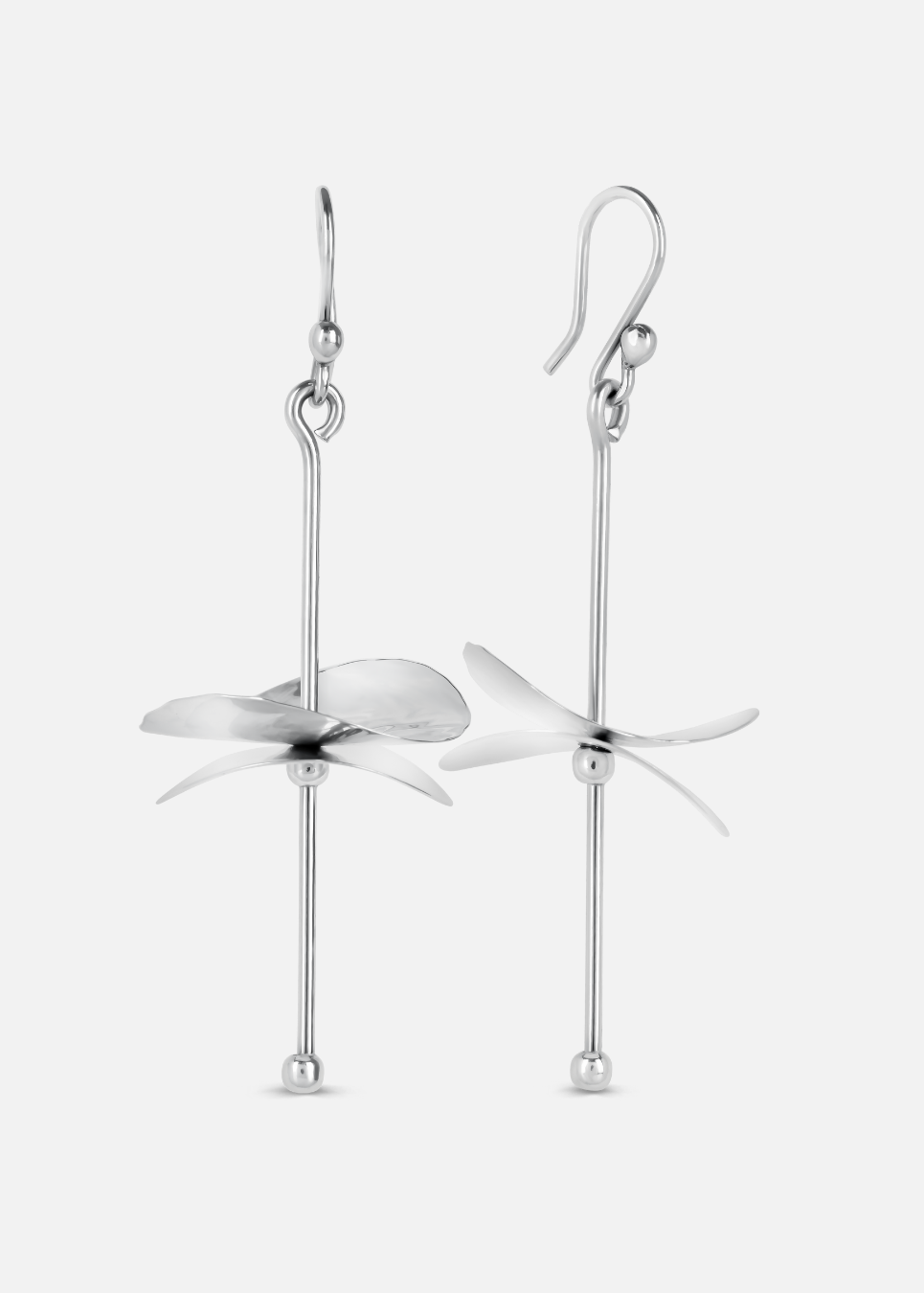 A pair of silver earrings designed to resemble cymbals, with a loop at one end for wearing and a longer hanging silver structure with a flat, disc-like shape at the bottom, against a white background.