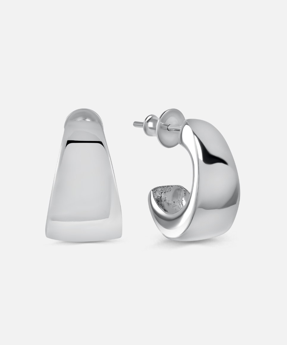 Silver hoop earrings on a light gray background