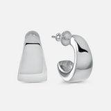 Silver hoop earrings on a light gray background