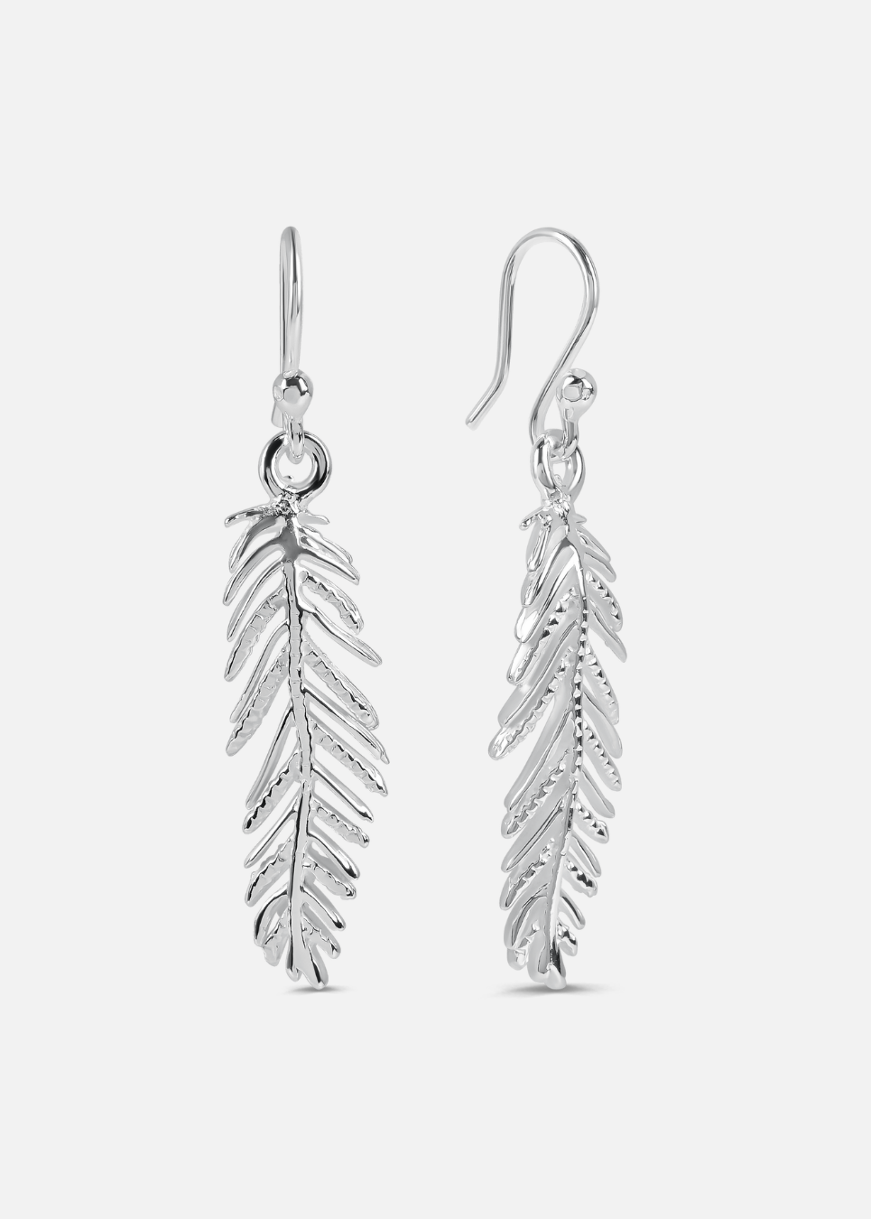 Silver feather-shaped earrings on a white background