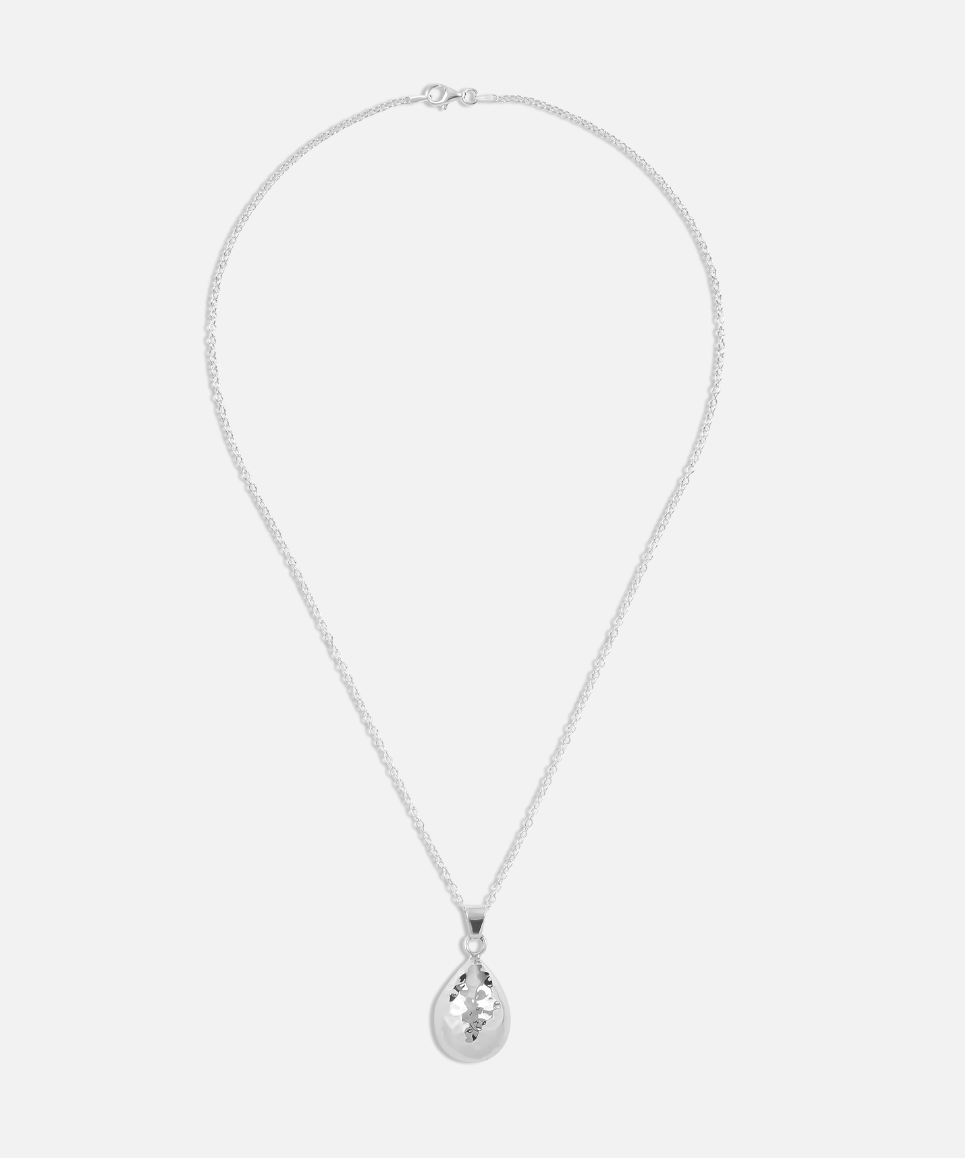 A silver hammered teardrop pendant necklace on a plain background.